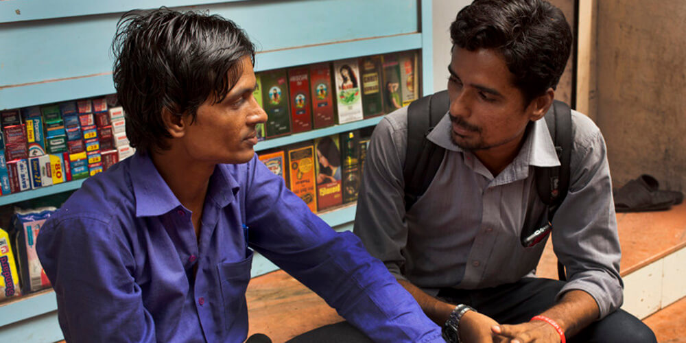 two men talking in india tb patient