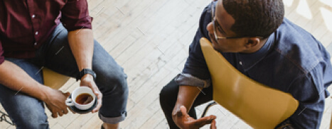 People sitting in chairs having an informal meeting