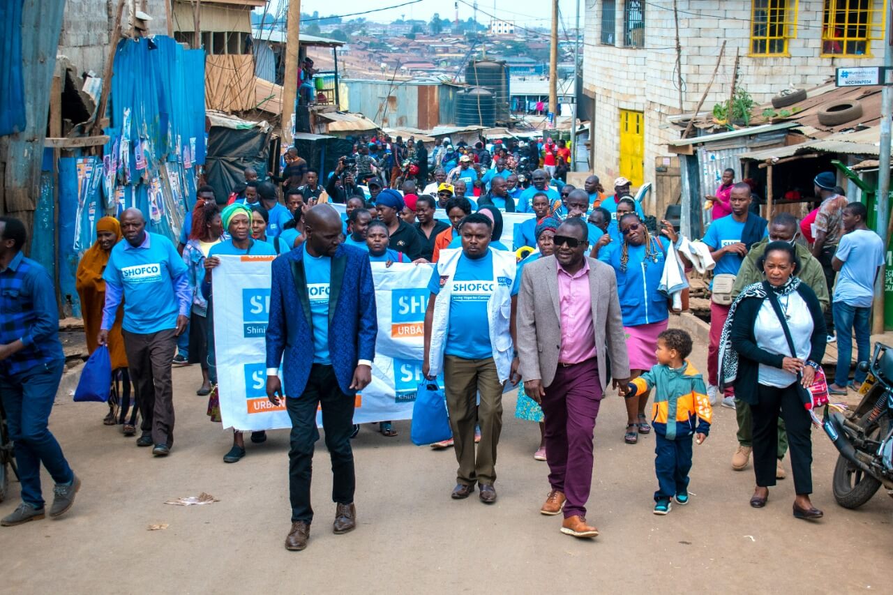 SHOFCO Health team members walking through street for a peace march