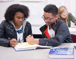 Two students working at a desk