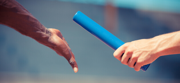 Relay race baton hand off.