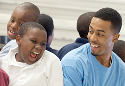 A WINGSLeader works with a group of elementary school children during one of its after-school programs.