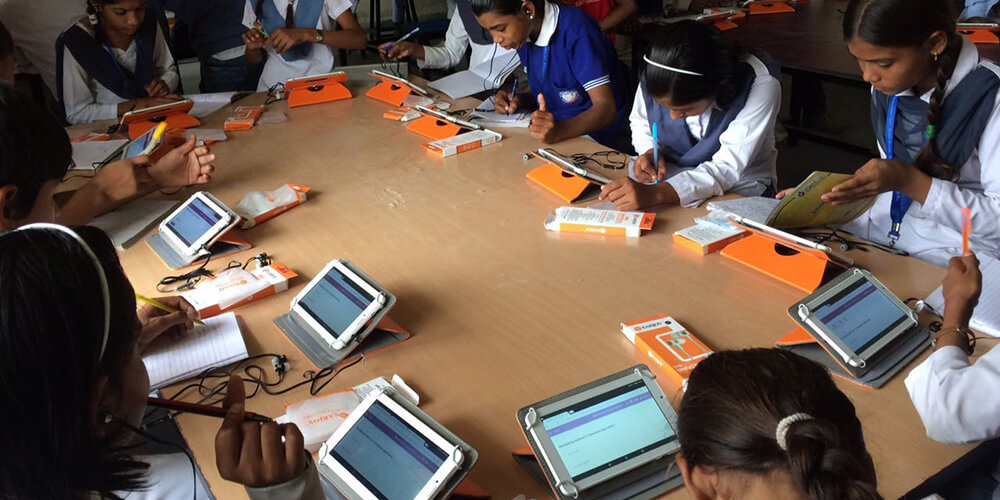 girl students at adarsh school with e-learning tools