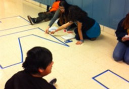 High school students work together to learn geometry concepts.