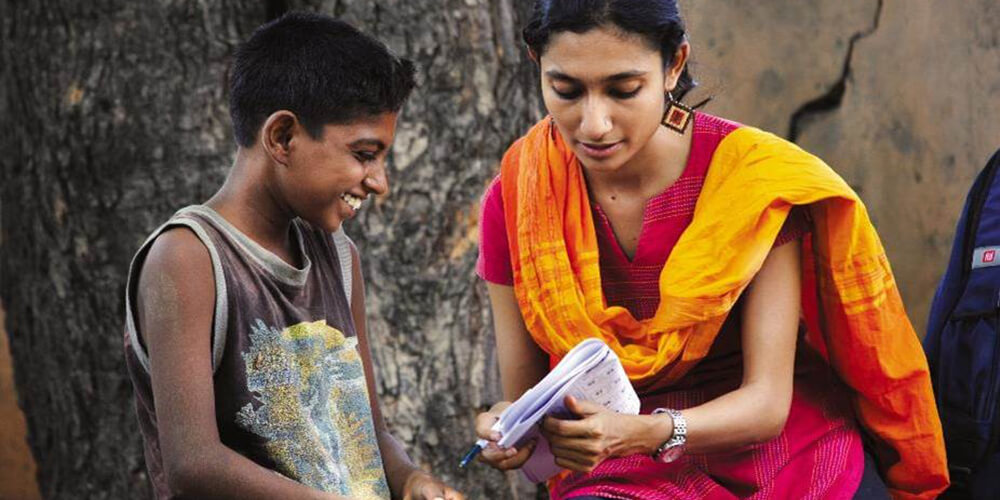 woman reading to child in India