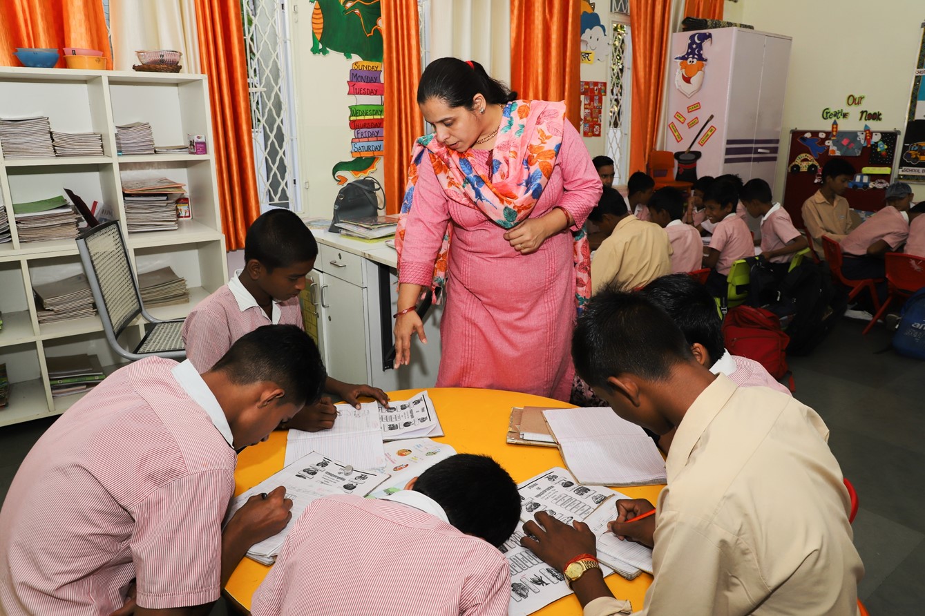 Teacher Neha Malhotra instructs students at the Prerna Boys School in Gomti Nagar, Lucknow, India, October 31, 2023.