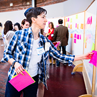 Person working on a workshop wall presentation