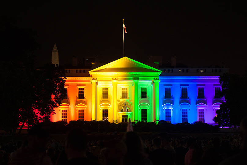 white house lit up in rainbow colors