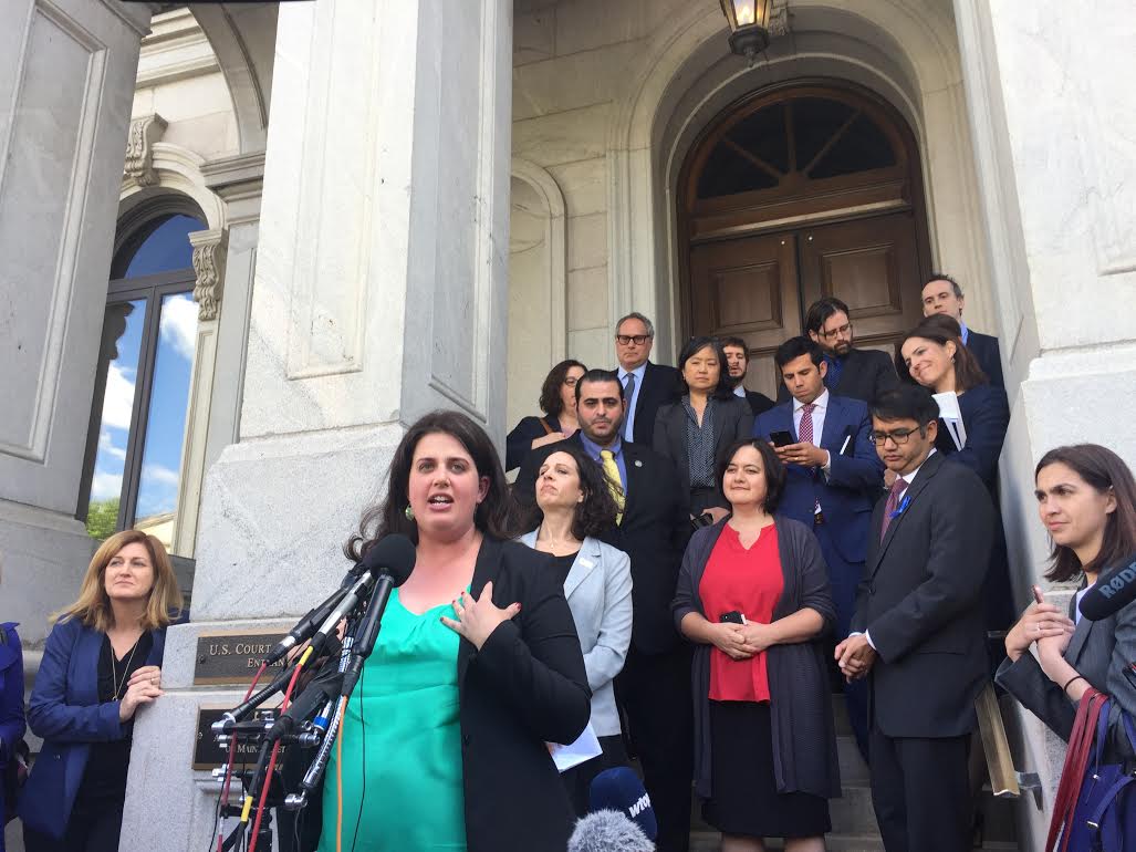 Becca Heller speaking at a press conference