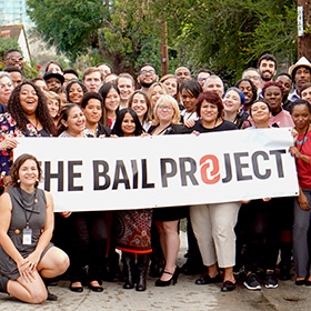 The Bail Project group photo with banner.
