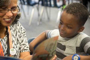 An adult reading with a child