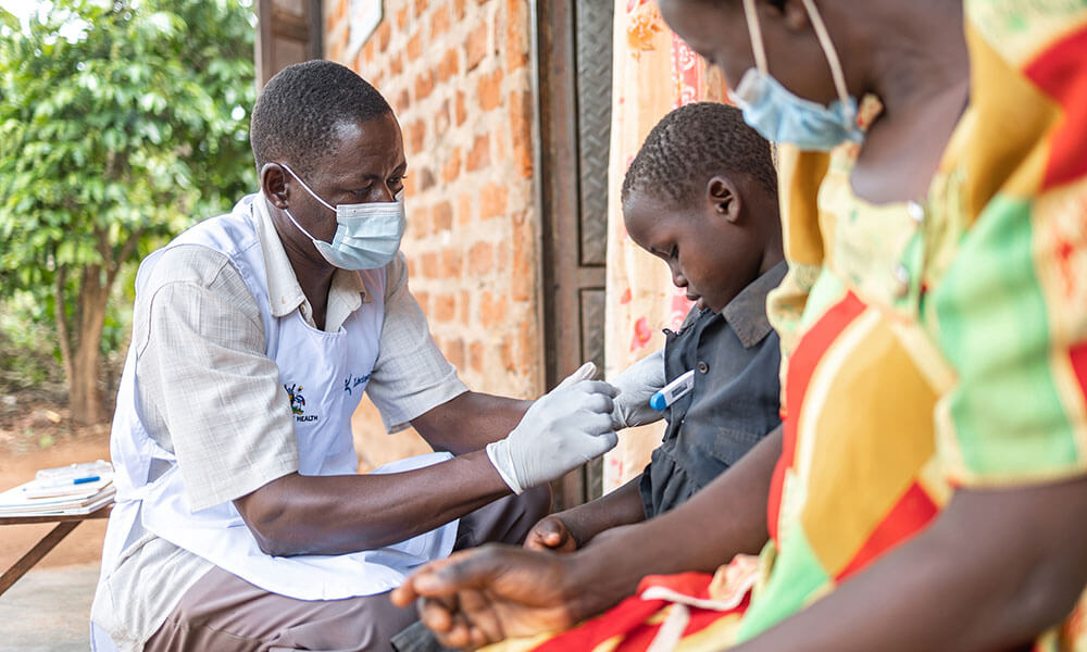 Man Taking Child's Temperature