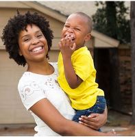 Woman holding small child